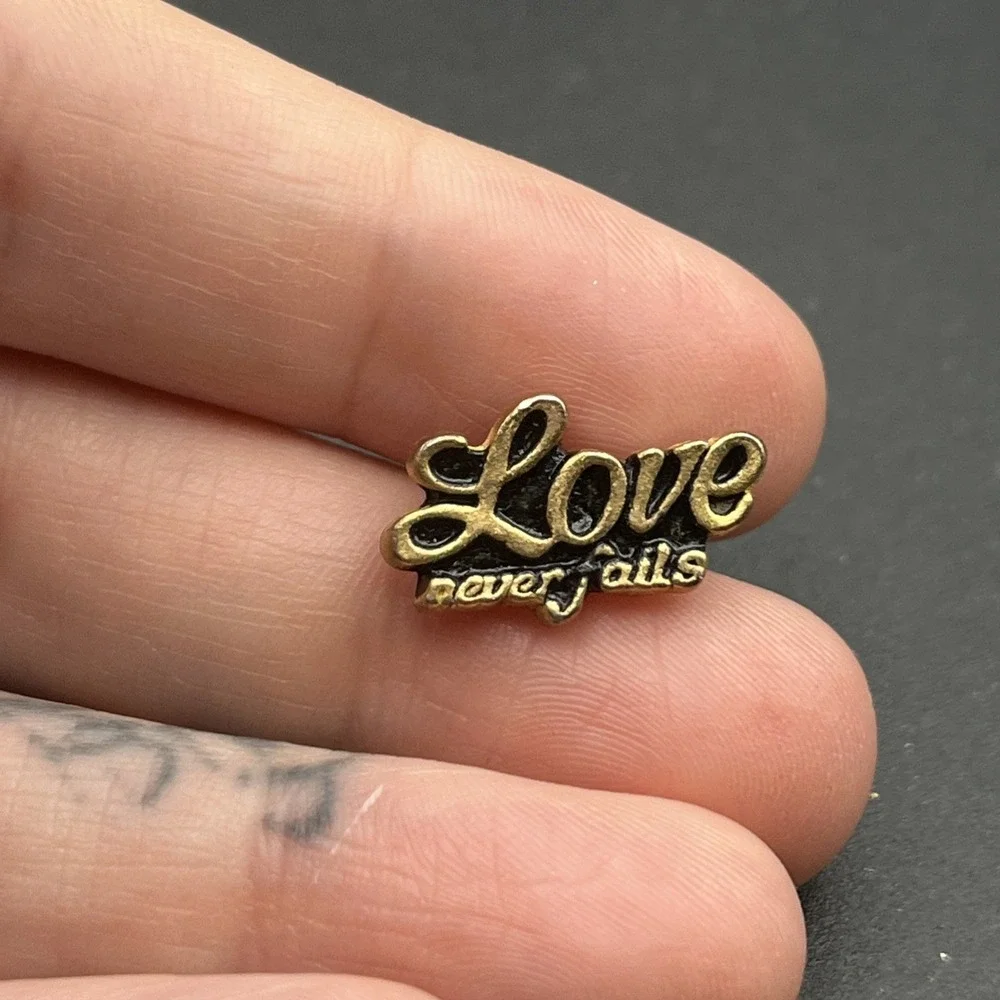 Love Never Fails Gold Tone Lapel Hat Pin